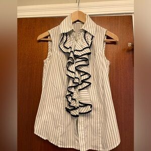 Ruffle front sleeveless blouse